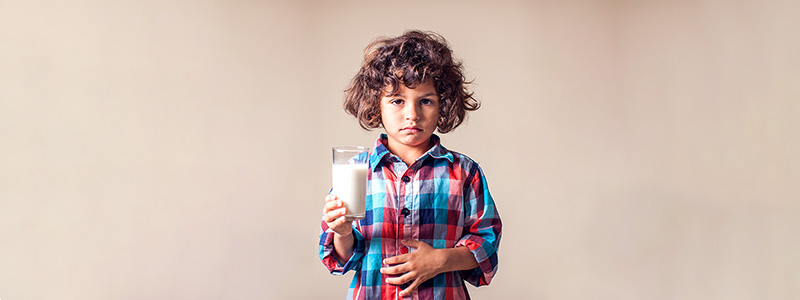 Child holding a glass of milk