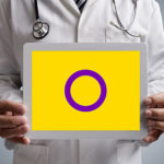 Doctor holding iPad with Intersex flag