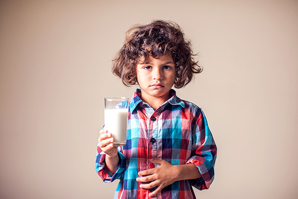 Child with glass of milk