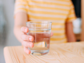 Child holding glass of water