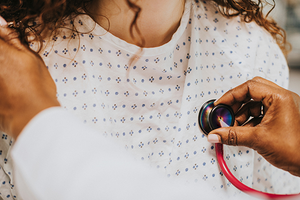 Physician examining a patient's heart